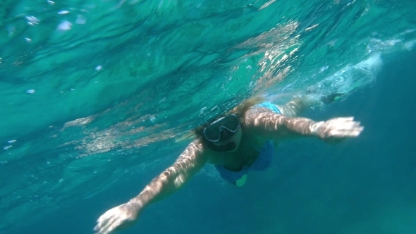 Woman Swimming With Snorkel In Red Sea