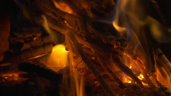 Wooden Sticks On Fire And Ash In The Fireplace