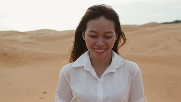 Asian Woman Smile Outdoor Desert Wind Blowing Hair