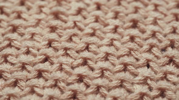 Knitted Wool Beige Fabric Closeup Features of Washing Clothes Texture Background with Garter Stitch