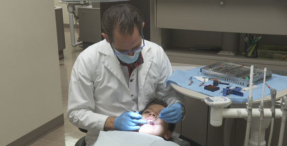 Dentist Works On Kids Teeth