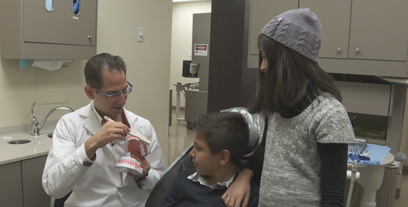 Dentist Shows Kids How To Brush