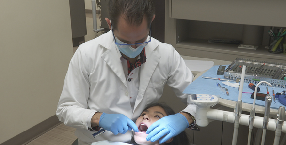 Dentist Checks Young Girl Bite