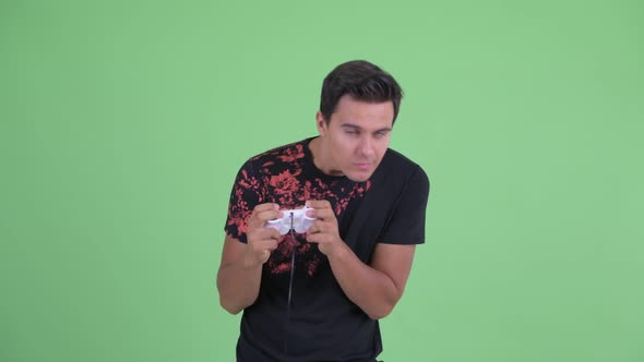 Stressed Young Man Playing Games and Losing