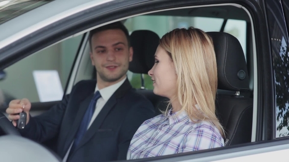 Salesman Hands Over The Keys To The Buyer
