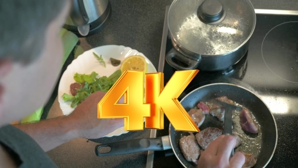 Man Cooking Tasty Supper At Home alt