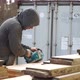 Working Man Is Polishing a Piece of Wood with a Machine for Grinding in the Hands - VideoHive Item for Sale