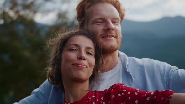 Happy Couple Spending Vacation in Mountains