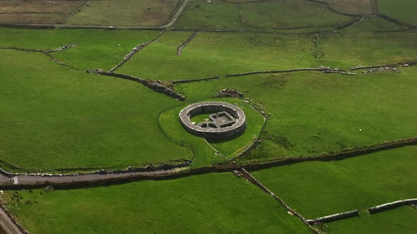 Loher Ringfort, Kerry, Ireland, March 2022. Drone orbits the ancient monument from the northeast whi