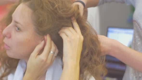 Two Stylists Hairdressers Are Making Hairstyle