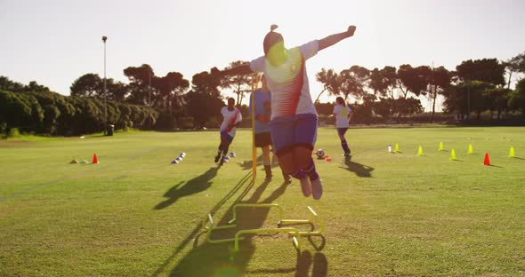 Female soccer team training on soccer field 4k