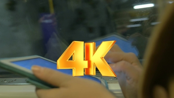 Tablet In Hands Of Subway Passenger