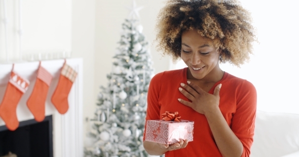 Excited Young Woman With An Unexpected Gift