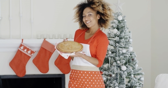 Happy Trendy Young Woman With a Christmas Dessert