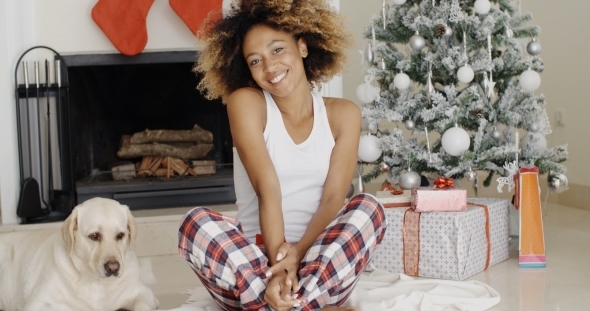 Cute Young Woman And Her Dog At Christmas