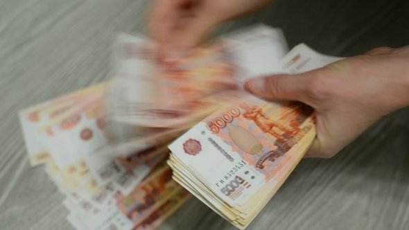 Women Hands Counting Russian Banknotes. 