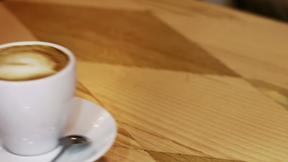 Coffee Cup On Wooden Table.