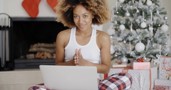 Pretty Young Student In Front Of a Christmas Tree