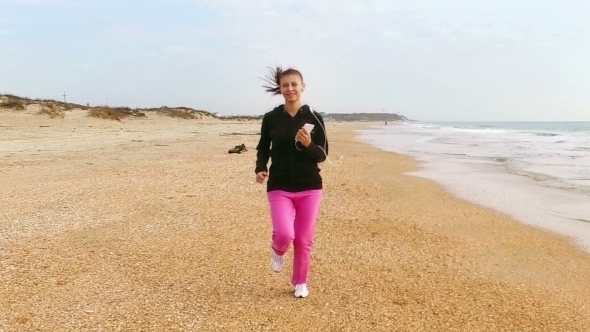 Young Woman Jog At Sand Sea Coast