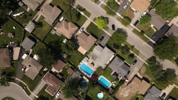 Aerial top down shot showing luxury district with pools in garden of luxury villas in Welland