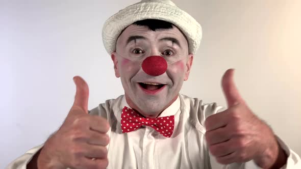 Emoji Clown. A clown mime rejoices and gives two thumbs up. (Closeup shot size)