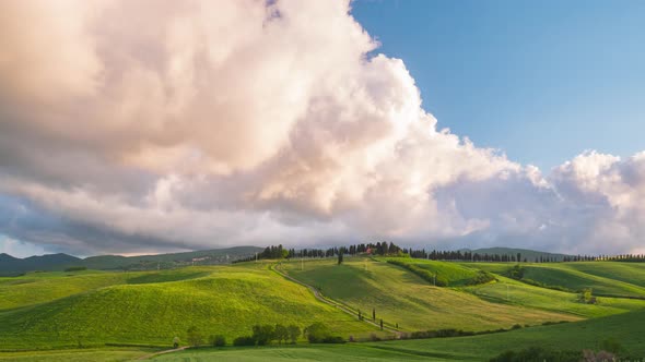 Time lapse: unique green landscape in Volterra region, Tuscany, Italy. Scenic clouds moving by wind.