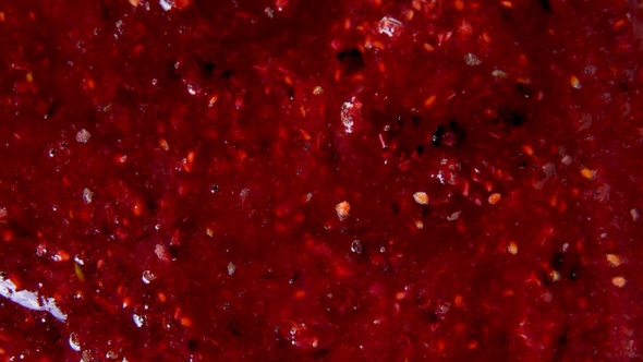 Fresh jam from raspberries, red currants and gooseberry, background. Natural texture.