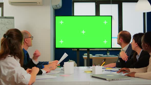 Tv Green Screen Mockup Ready for Presentation Placed in Front of Desk