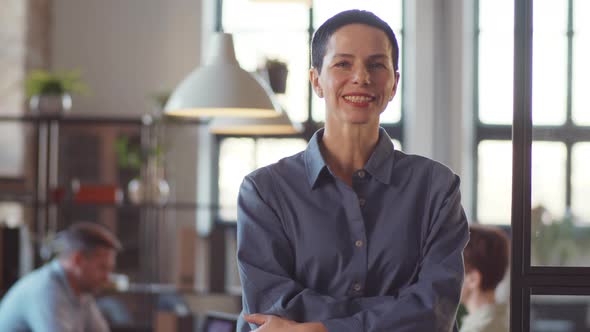 Portrait of Smiling Middle Aged Businesswoman in Office