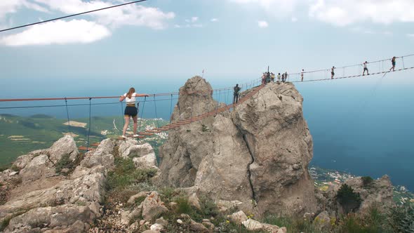 People on Suspension Bridge