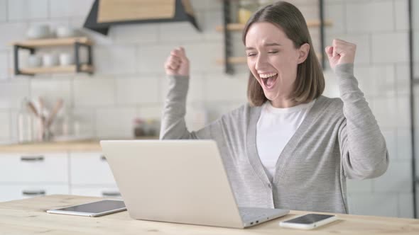 Success Young Woman Celebrating on Laptop