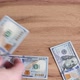 Person counts hundred dollar bills by throwing them on table, exchange rate, finance and business. - VideoHive Item for Sale