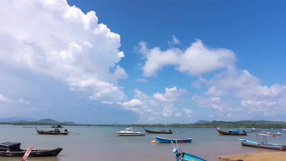 Beautiful blue sky white clouds over sea in the morning with Thai Longtail fisherman boats