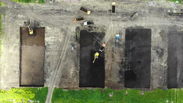 Construction process. Pit for building. Construction site from the air.