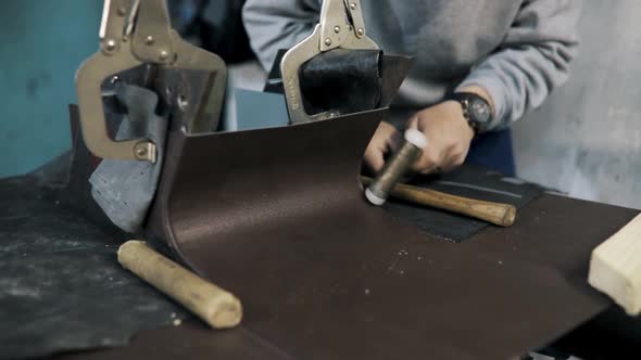 Close Up Pf a Tinsmith Blacksmith Hands Use Hammer Working in His Workshop