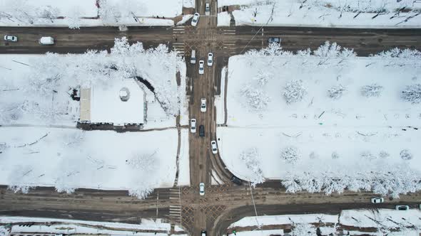 Aerial Top Down View of Snowy City Asphalt Road Landscapes in Winter