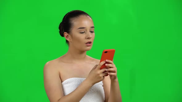 Spa Woman Sends Message on Mobile Then Makes Selfie. Green Screen