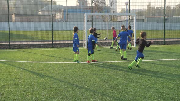 Little Football Player Scoring Goal From Penalty