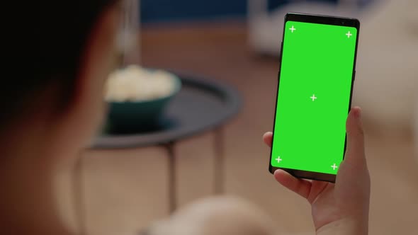 Close Up on Mobile Phone with Vertical Green Screen