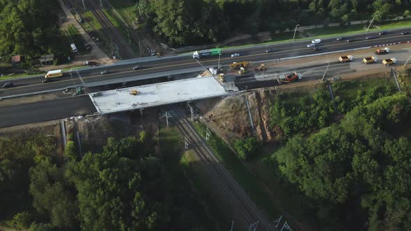 Repair of an overpass on a busy city highway across the railway.  Aerial photography.
