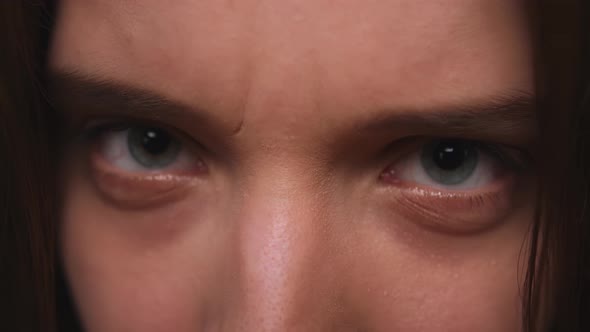 Closeup of Woman Aggressive Face Woman Has Beautiful Blue Eyes