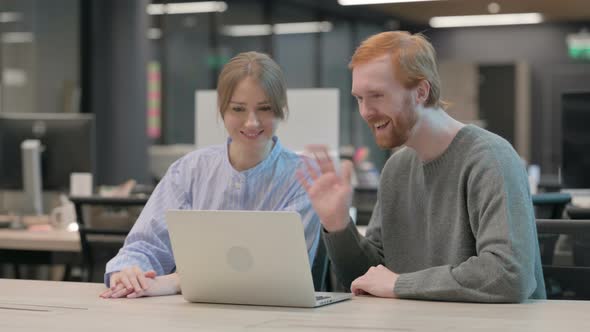 Young Man and Woman Talking on Video Call on Laptop