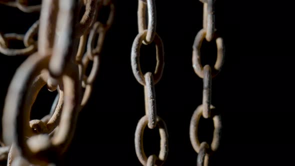 Old Metal Chain with Rusted Links on Black Isolated Studio Background