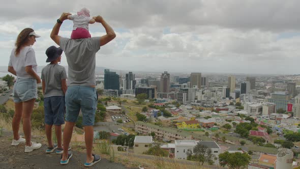 Family Looks at Cape Town From the Mountain