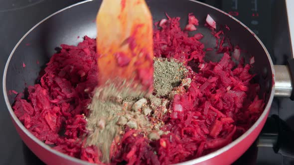 Cooking Vegetables in a Frying Pan Beetroot Carrot Onion Garlic Spices