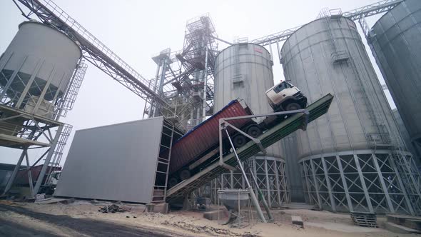 Large grain storage. Old truck on the background of the elevator