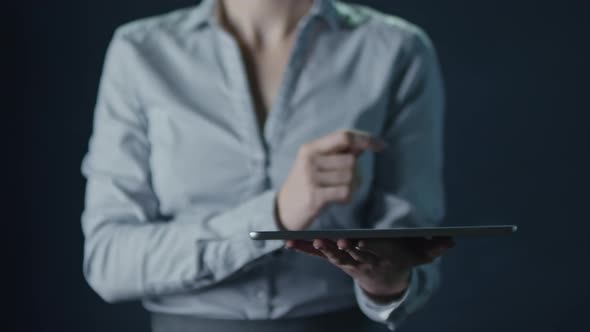 Woman Touching Screen of Tablet