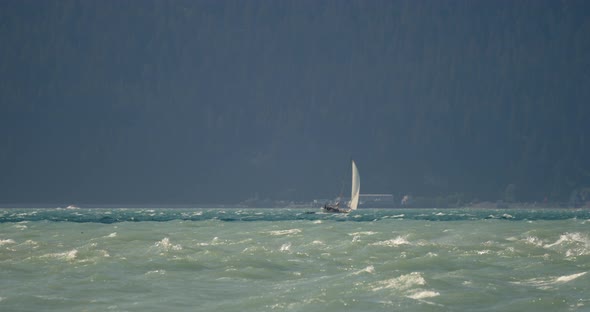 Lonely Sailboat at Rough Sea Near Alaskan Coastline, Slow Motion Wide View