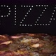 Delicious Fresh Italian Pizza  On A Black Background With The Effect Of Light Inscription Pizza - VideoHive Item for Sale