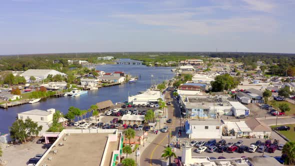 Lowering Aerial View of a Lake Passing Through the City of New Port Richey